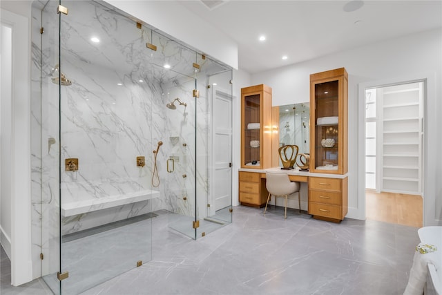 bathroom with vanity and an enclosed shower