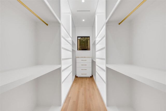 spacious closet featuring light hardwood / wood-style flooring