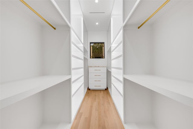 spacious closet with light hardwood / wood-style floors