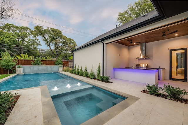 view of pool featuring a patio, an in ground hot tub, ceiling fan, and pool water feature