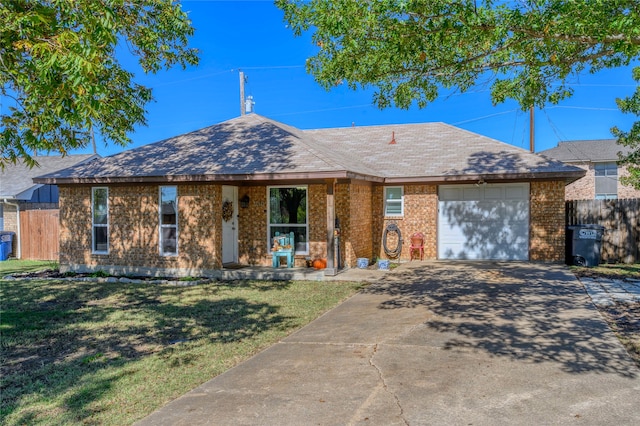 single story home with a garage, a front lawn, and covered porch