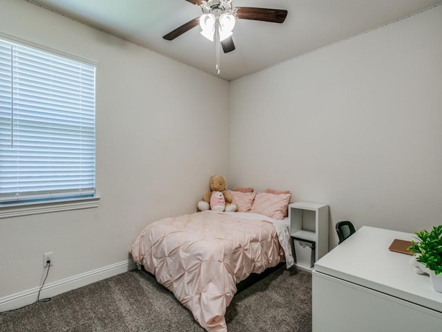 bedroom featuring dark colored carpet and ceiling fan