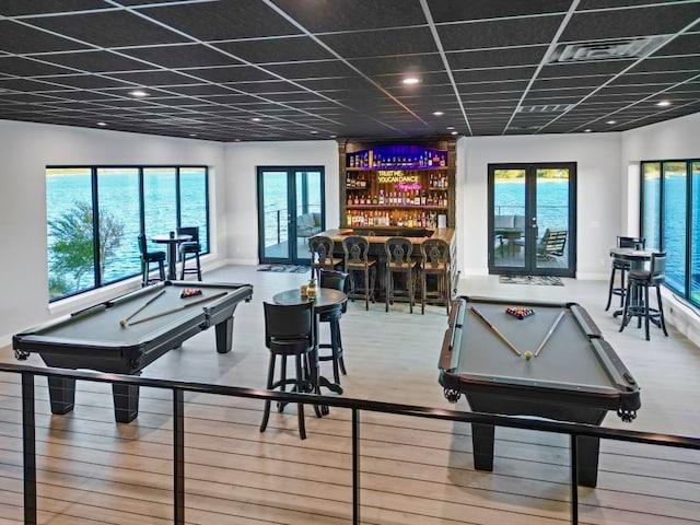 rec room with french doors, billiards, indoor bar, and a paneled ceiling