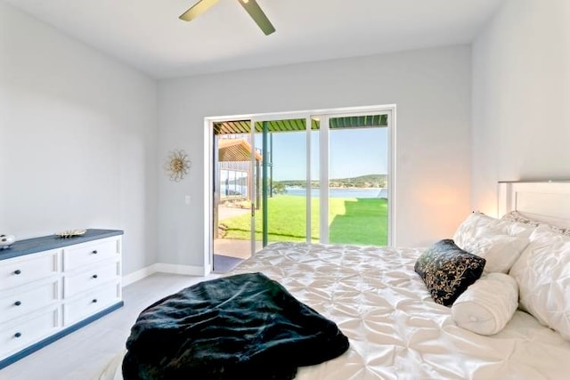 bedroom with access to exterior and ceiling fan