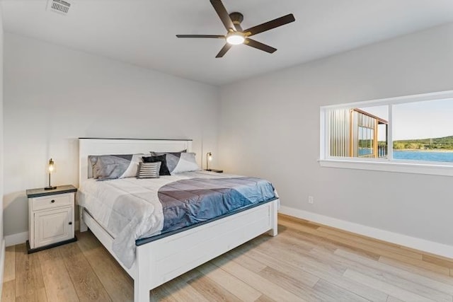 bedroom featuring light wood-type flooring and ceiling fan