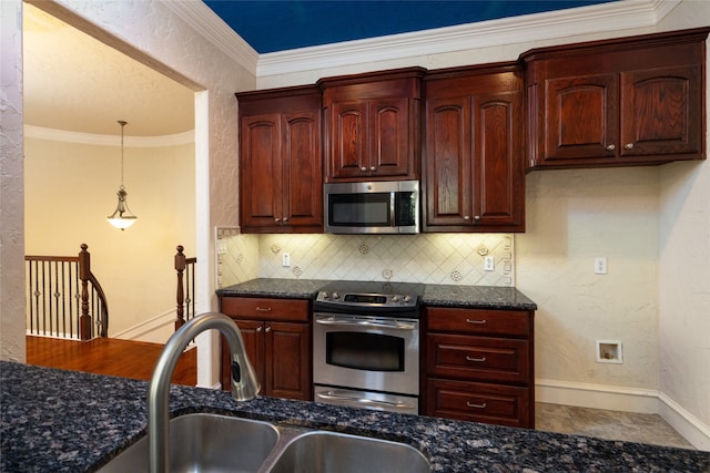 kitchen with stainless steel appliances, dark stone counters, sink, ornamental molding, and backsplash