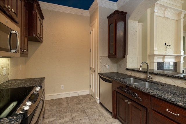 kitchen featuring sink, appliances with stainless steel finishes, tasteful backsplash, dark brown cabinets, and crown molding