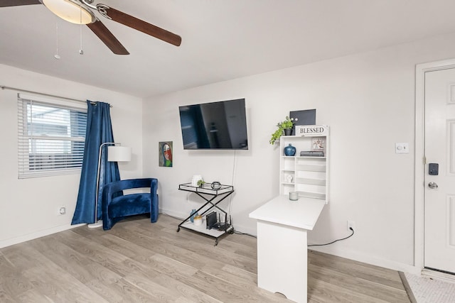 interior space with ceiling fan and light wood-type flooring