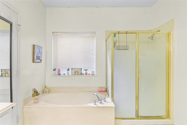 bathroom with vanity and separate shower and tub