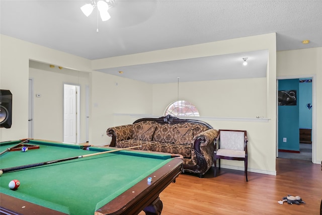 playroom featuring hardwood / wood-style floors, ceiling fan, a textured ceiling, and billiards