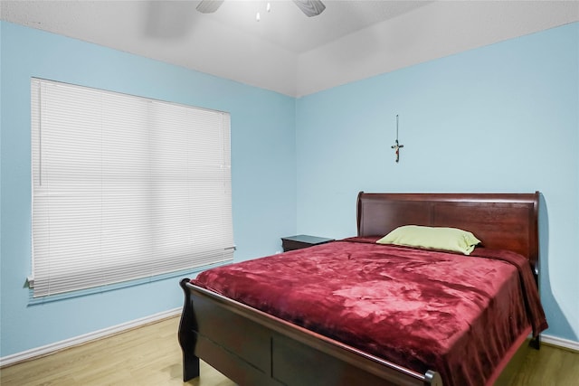 bedroom featuring hardwood / wood-style flooring and ceiling fan