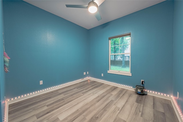 spare room featuring ceiling fan and light hardwood / wood-style floors