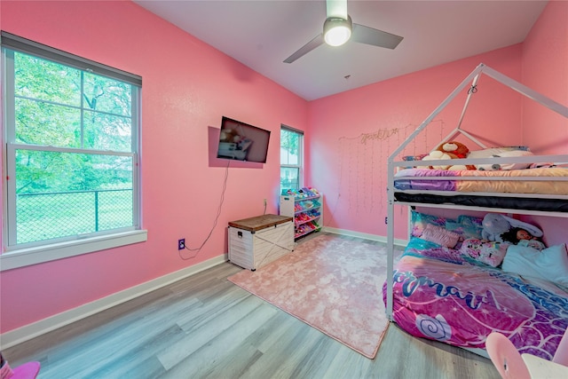 bedroom with wood-type flooring and ceiling fan