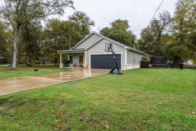 exterior space with a trampoline and a garage