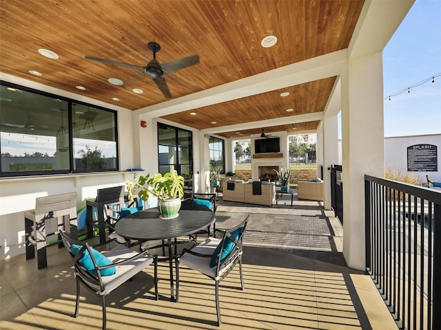 5270 Town And Country Blvd Unit 205, Frisco, TX 75034 - view of patio / terrace featuring an outdoor living space with a fireplace and ceiling fan