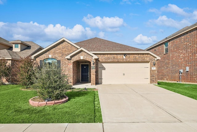 view of front of home with a garage and a front lawn