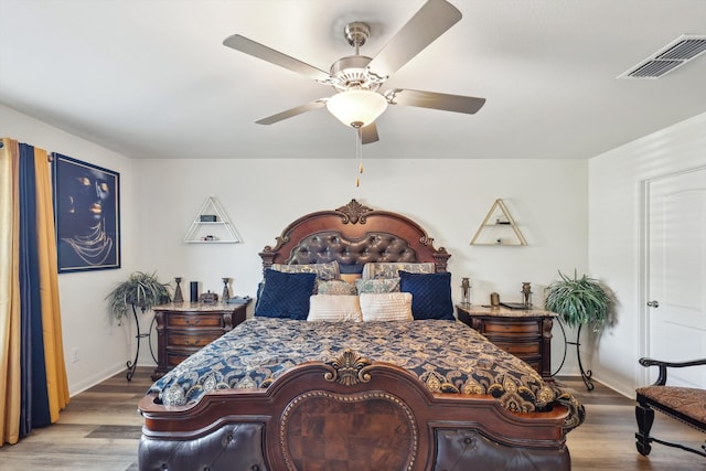 bedroom with light wood-type flooring and ceiling fan