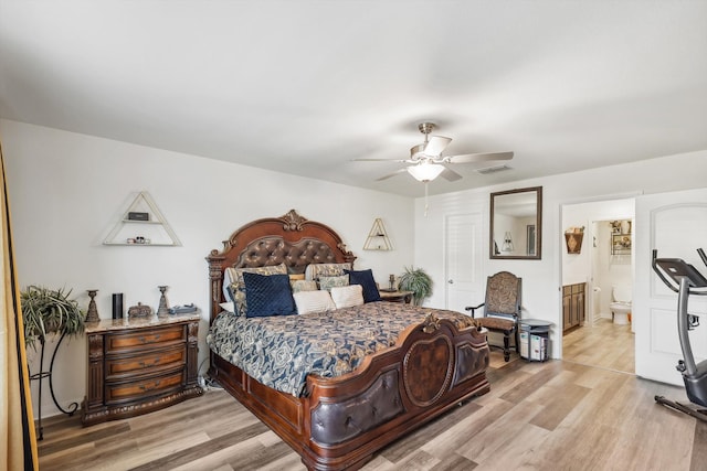 bedroom featuring connected bathroom, light wood-type flooring, and ceiling fan