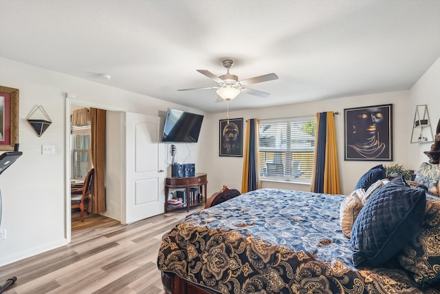 bedroom featuring light hardwood / wood-style floors and ceiling fan