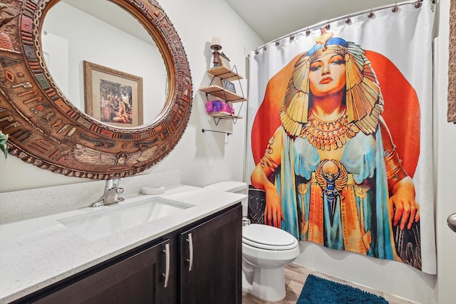 full bathroom with wood-type flooring, vanity, toilet, and shower / bathtub combination with curtain