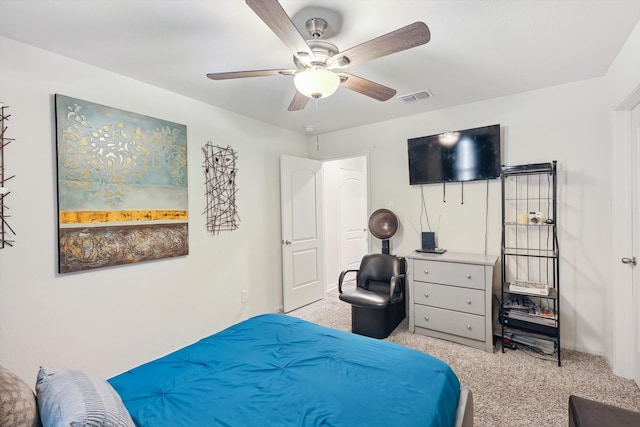 bedroom featuring light carpet and ceiling fan