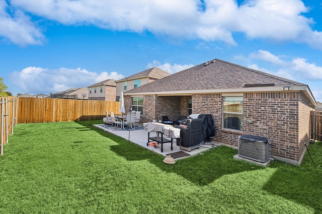 back of house featuring central AC unit, an outdoor living space, a patio, and a yard