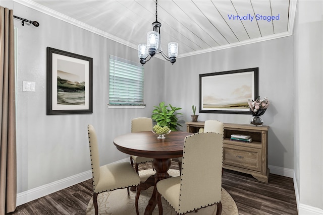 dining space featuring ornamental molding, dark hardwood / wood-style floors, and an inviting chandelier