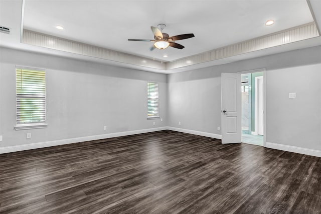 unfurnished room with dark wood-type flooring and ceiling fan