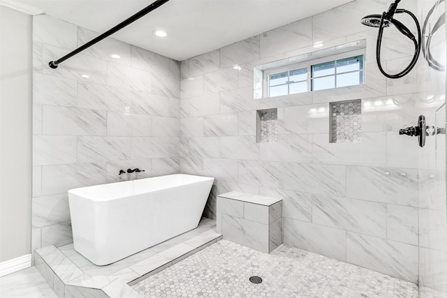 bathroom featuring independent shower and bath and tile walls