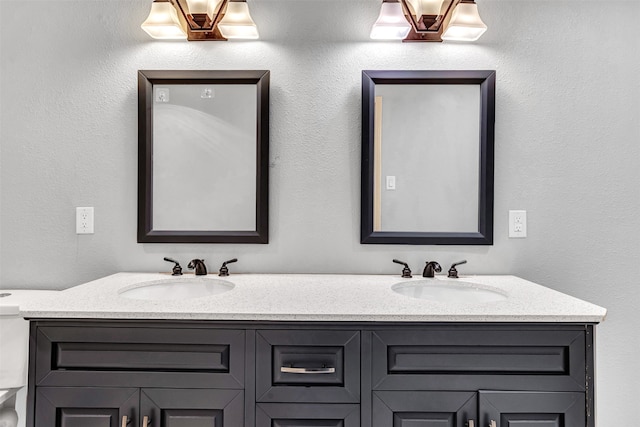 bathroom with toilet and vanity