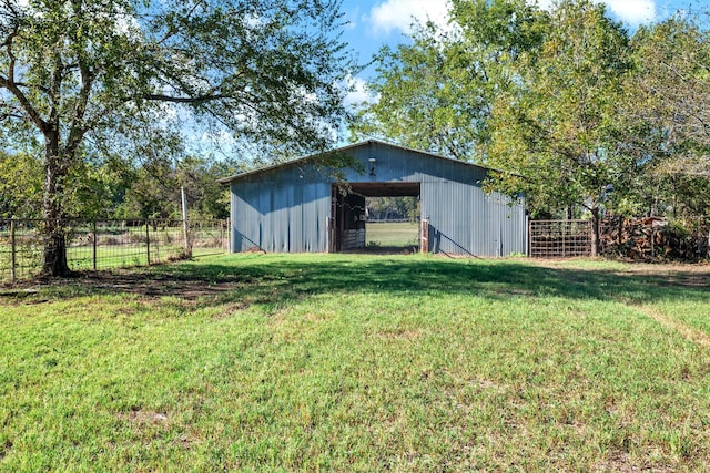 view of outbuilding with a lawn