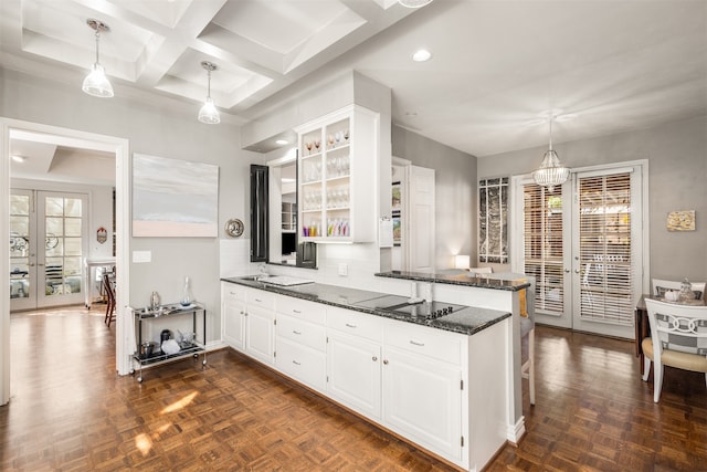 kitchen with french doors, decorative light fixtures, dark parquet floors, and white cabinets