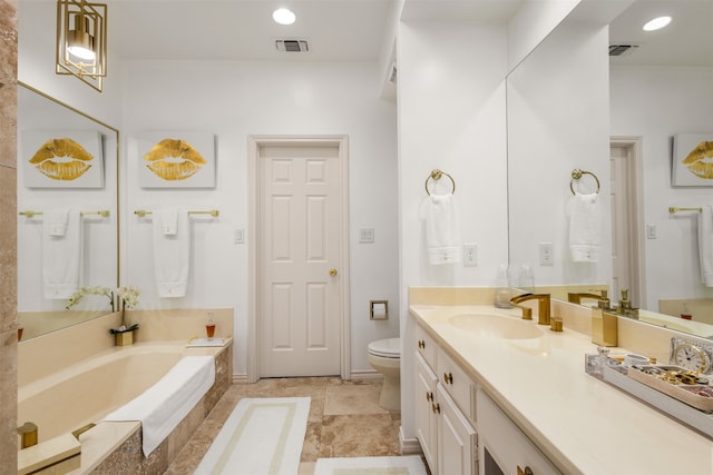 bathroom featuring toilet, vanity, and tiled bath