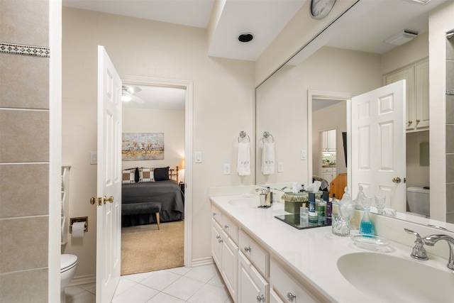 bathroom with tile patterned floors, toilet, and vanity