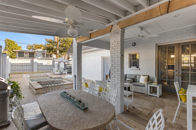 view of patio / terrace featuring ceiling fan, a pool, and grilling area