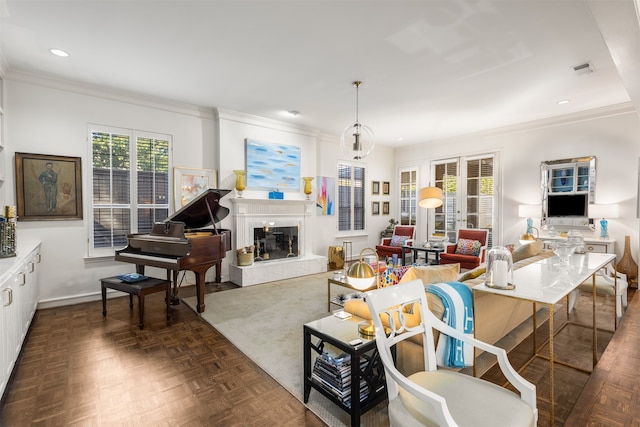 living room featuring dark parquet flooring and ornamental molding