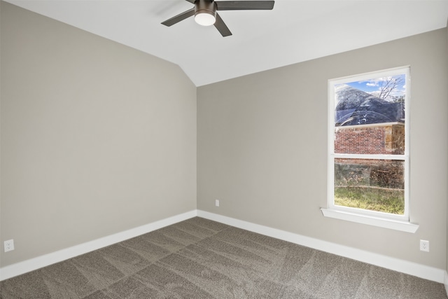 carpeted empty room featuring a wealth of natural light, lofted ceiling, and ceiling fan