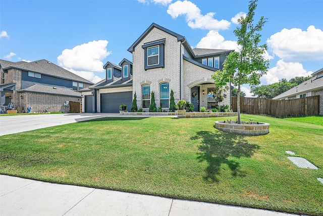 view of front facade featuring a garage and a front lawn