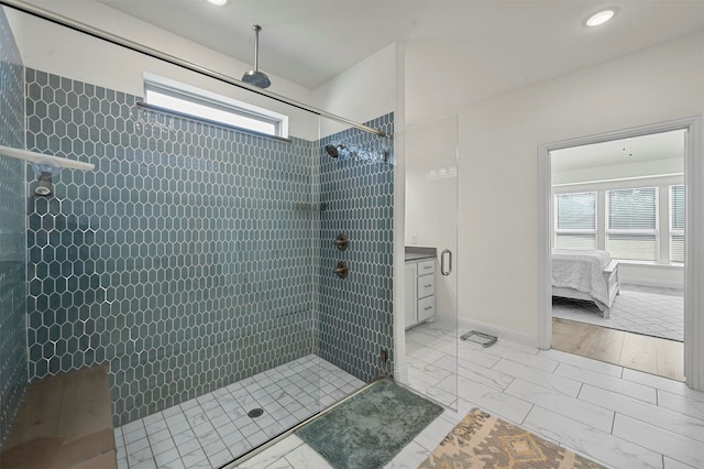 bathroom with a wealth of natural light and a tile shower