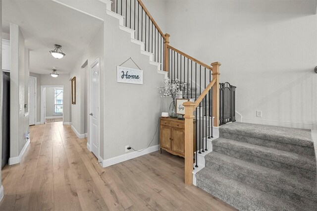 staircase with wood-type flooring