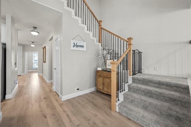 stairs featuring hardwood / wood-style flooring