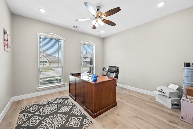 office space featuring light hardwood / wood-style floors and ceiling fan