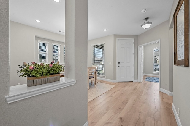 hall with light hardwood / wood-style floors