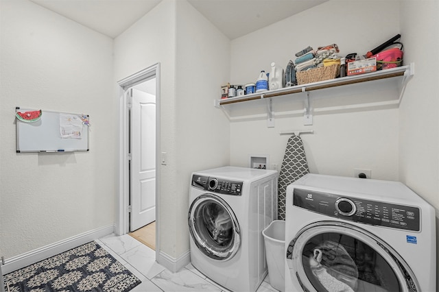 clothes washing area featuring washing machine and dryer