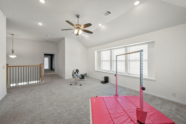 exercise area with carpet floors, ceiling fan, and vaulted ceiling