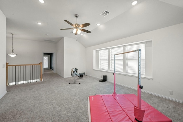 workout room with carpet flooring, vaulted ceiling, and a wealth of natural light