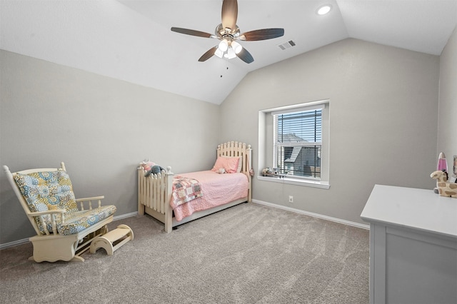 bedroom with ceiling fan, lofted ceiling, and carpet