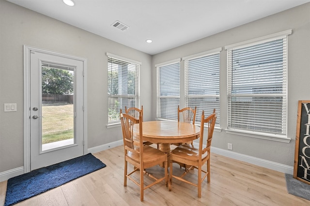 dining room featuring light wood-type flooring and plenty of natural light