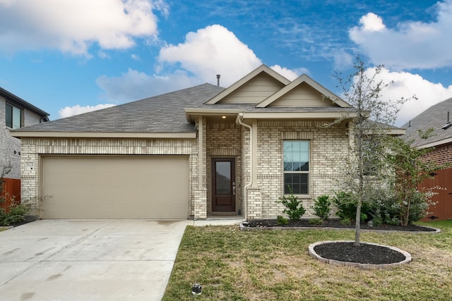 view of front facade with a garage and a front yard