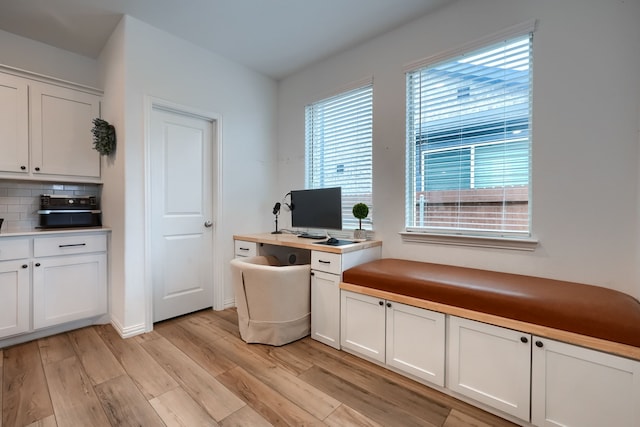 office space with light wood-type flooring